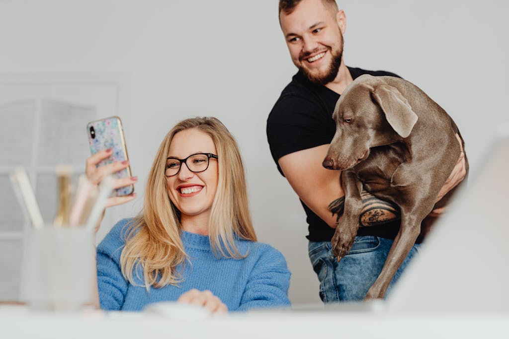 Man and Woman and Dog on Phone Call